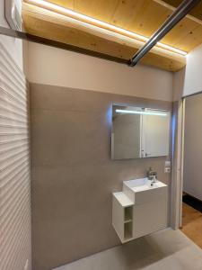 a bathroom with a sink and a mirror at Casa Italia locazione turistica in Falze