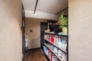 a walk in pantry with a shelf full of food at Hotel Akasaka Heights in Fukuoka +43 photos