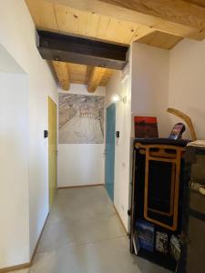 a hallway in a house with a painting on the wall at Casa Italia locazione turistica in Falze