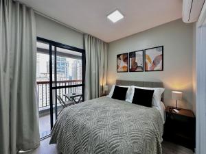 Ένα ή περισσότερα κρεβάτια σε δωμάτιο στο Studio com piscina a 1 minuto a pé do Metrô Brooklin +31 φωτογραφίες