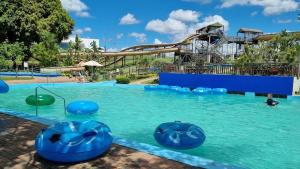 a large swimming pool with a water slide at Uptown Apartments - Garden Pavillion in Nelspruit