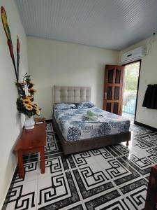 Hotel Alto Amazonas客房内的一张或多张床位
