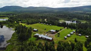 an aerial view of a farm near a lake at Stuga 1 in Arvidsjaur