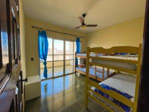 En eller flere senge i et værelse på Casa para Temporada