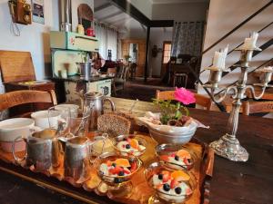 a table with plates of food on top of it at Naauwpoort View in Clarens