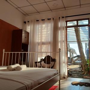 Ένα ή περισσότερα κρεβάτια σε δωμάτιο στο La-Vira Beach Villa