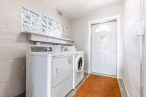 a white laundry room with a washer and dryer at Heights Dream Libby Unit 6 in Maple Heights