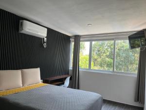 Postel nebo postele na pokoji v ubytování Hotel Natuur