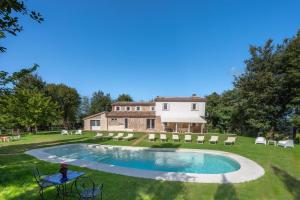 an estate with a swimming pool and a house at Villa ai Caprioli Mondaino in Mondaino