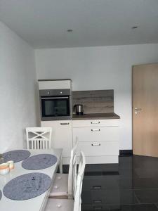 Kuchyň nebo kuchyňský kout v ubytování Schöne Anliegerwohnung