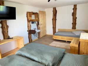 Ένα ή περισσότερα κρεβάτια σε δωμάτιο στο Ferienwohnung Kaltenleitner