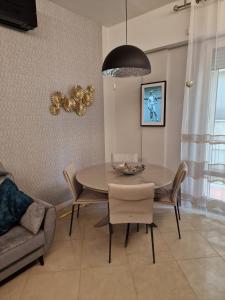 a dining room with a table and chairs at Novoli Chic: Cuore di Firenze in Florence