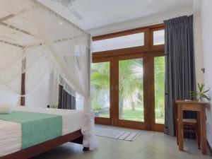 Ένα ή περισσότερα κρεβάτια σε δωμάτιο στο New Ocean Breeze Madiha