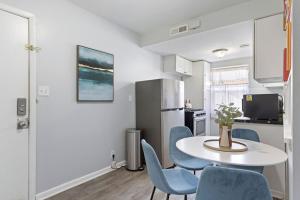 a kitchen and dining room with a table and chairs at Heights Dream Libby Unit 6 in Maple Heights