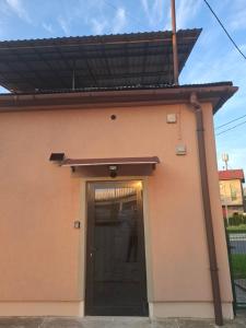 a building with a door and a roof over it at Apartament Maja in Bielsko-Biała
