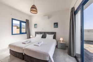 Postel nebo postele na pokoji v ubytování Diana Seaside Villas