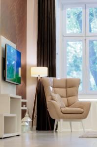 TV a/nebo společenská místnost v ubytování Apartman Mirakul
