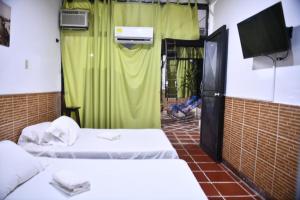 Postel nebo postele na pokoji v ubytování Hotel Kamellon