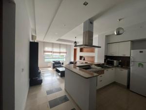 Kuchyň nebo kuchyňský kout v ubytování NOUR appartement