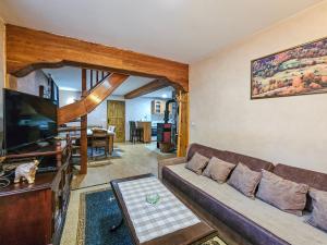 a living room with a couch and a flat screen tv at Vacation home Miki in Bajina Bašta