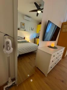 a bedroom with a bed and a large mirror at Apartman Vasanija in Opatija