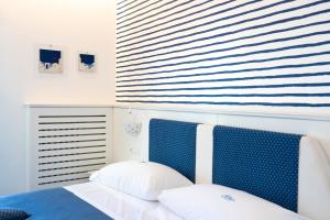 Postel nebo postele na pokoji v ubytování Hotel Calanca