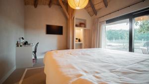 Postel nebo postele na pokoji v ubytování B&B Het Nagtegaaltje