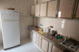 Dapur atau dapur kecil di bel appartement familial en residence
