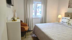 Posteľ alebo postele v izbe v ubytovaní Eximius Apartment