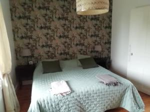 Postel nebo postele na pokoji v ubytování La charbonnière