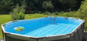 a swimming pool with a pool at Drevenica Tisovec in Tisovec