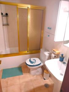 a bathroom with a shower and a toilet and a sink at Casa Jana in Los Alcázares +20 photos