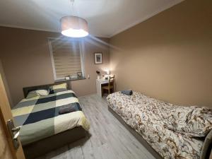 Ένα ή περισσότερα κρεβάτια σε δωμάτιο στο Apartament Antonio