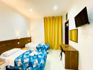 TV a/nebo společenská místnost v ubytování Milazzo Suites