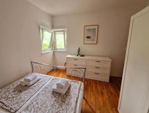 Postel nebo postele na pokoji v ubytování Apartment Oliva Rab + 30 fotografií