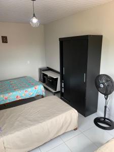 Ένα ή περισσότερα κρεβάτια σε δωμάτιο στο Casa Cariri