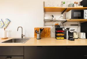 a kitchen with a sink and a counter top at Gran Sol 3BR - Sea View - AC & Wifi - 10 min to Beach in Rincón de la Victoria