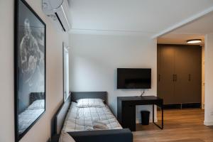 TV in/ali zabaviščno središče v nastanitvi REAL Suites