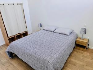 En eller flere senge i et værelse på Appartement Magnum