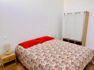 En eller flere senge i et værelse på Appartement Magnum