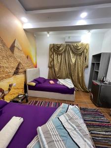 Postelja oz. postelje v sobi nastanitve 2 Jana Pyramids view inn