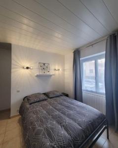 Postel nebo postele na pokoji v ubytování Appartement calme