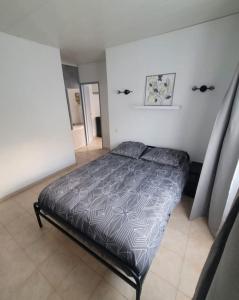 Postel nebo postele na pokoji v ubytování Appartement calme + 4 fotografie