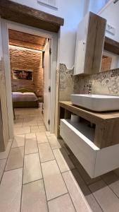 a bathroom with a sink and a bathroom with a bed at B&B Al TEATRO ROMANO 2 in Benevento +41 photos