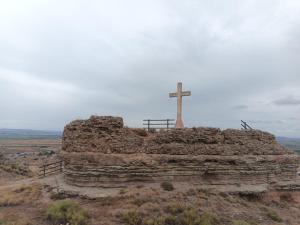a cross on top of a hill with a cross on top at Casa Carmen in Alcolea de Cinca +21 photos