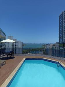 a large swimming pool on top of a building at Golden Gate Residence Service in Vitória
