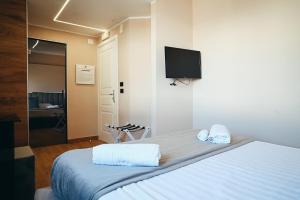 TV a/nebo společenská místnost v ubytování Puteoli Palace Hotel