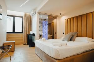 Postel nebo postele na pokoji v ubytování Puteoli Palace Hotel + 37 fotografií