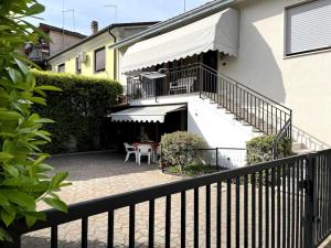 a balcony of a house with a table and chairs at Il Gelsomino - Venice Getaway with Free Parking & Fast Bus in Spinea