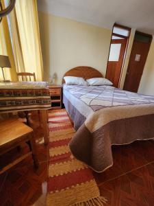 Postel nebo postele na pokoji v ubytování La Casa de Momo